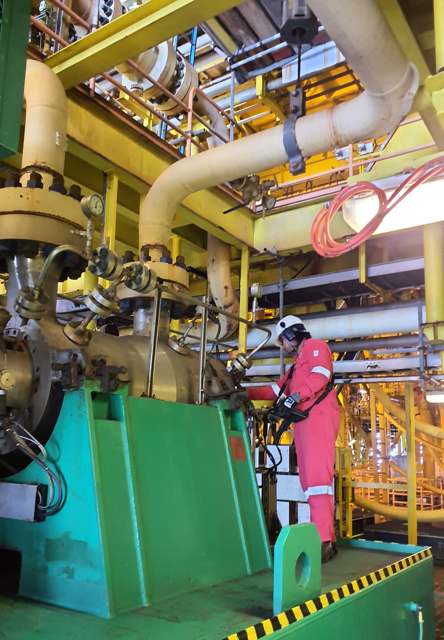 Technician conducting gas loss of containment inspection